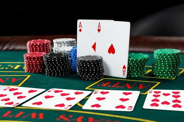 Free photo poker play. chips and cards on the green table