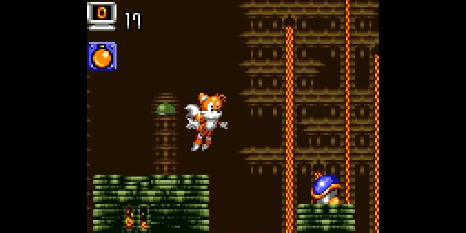 Gameplay của Tails Adventure trên Game Gear, nơi Tails sử dụng kỹ năng bay và ném bom để khám phá.