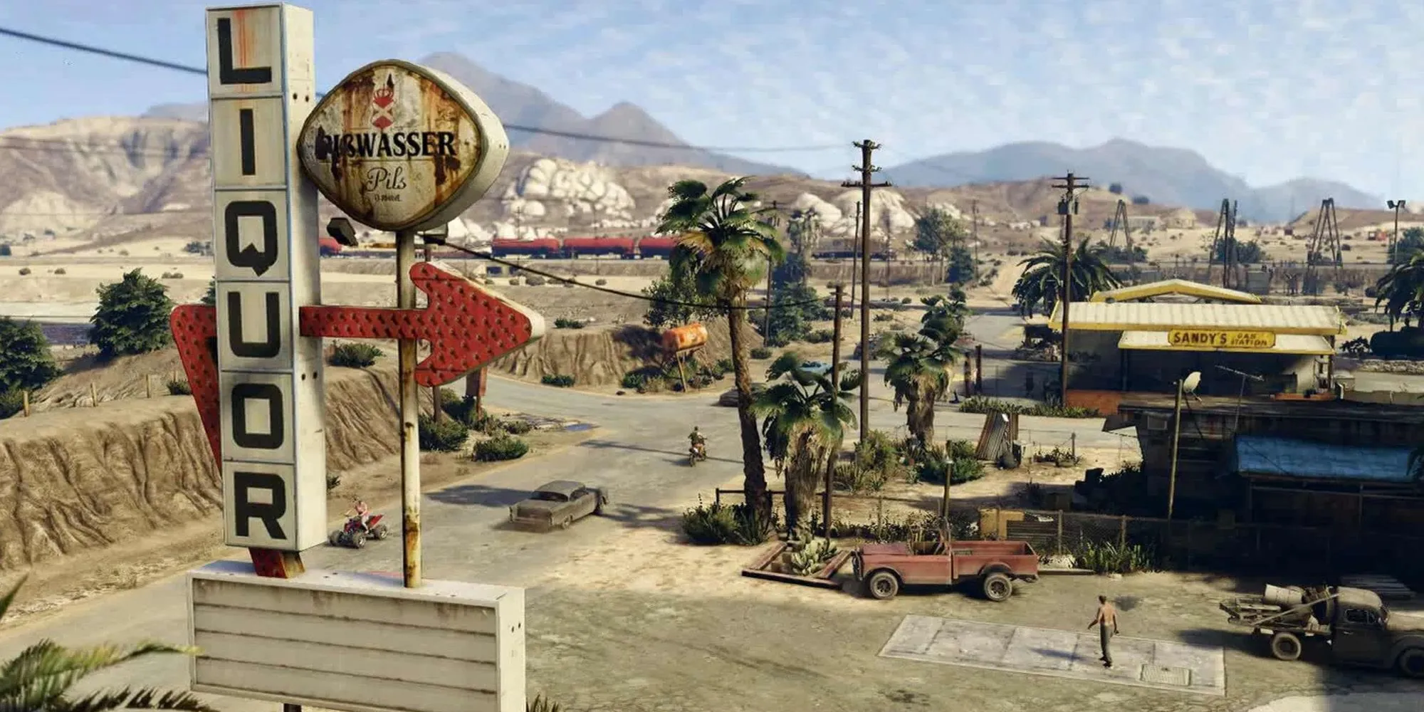 Khu vực Sandy Shores trong GTA 5 với khung cảnh sa mạc đặc trưng và dãy núi Chiliad ở phía xa
