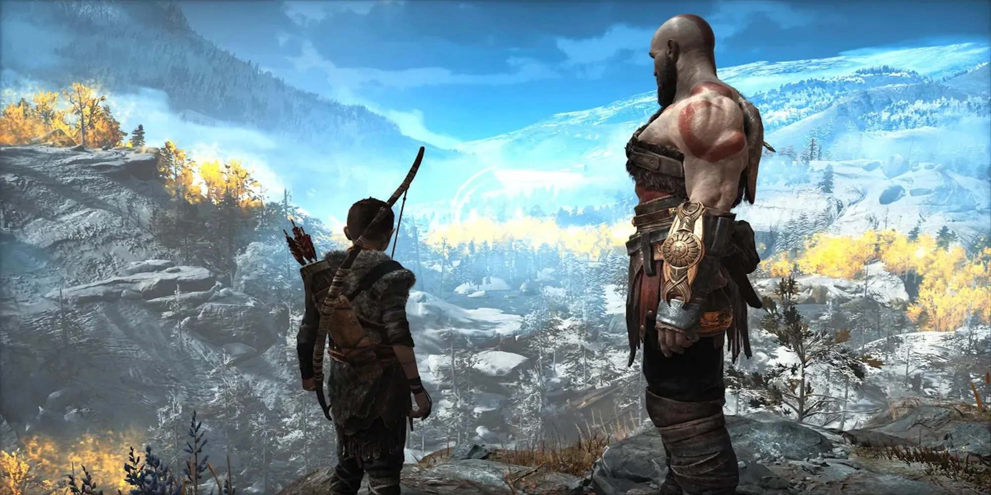 Kratos và Atreus trong God of War 2018 đang đứng trên một vách đá nhìn ra khung cảnh hùng vĩ