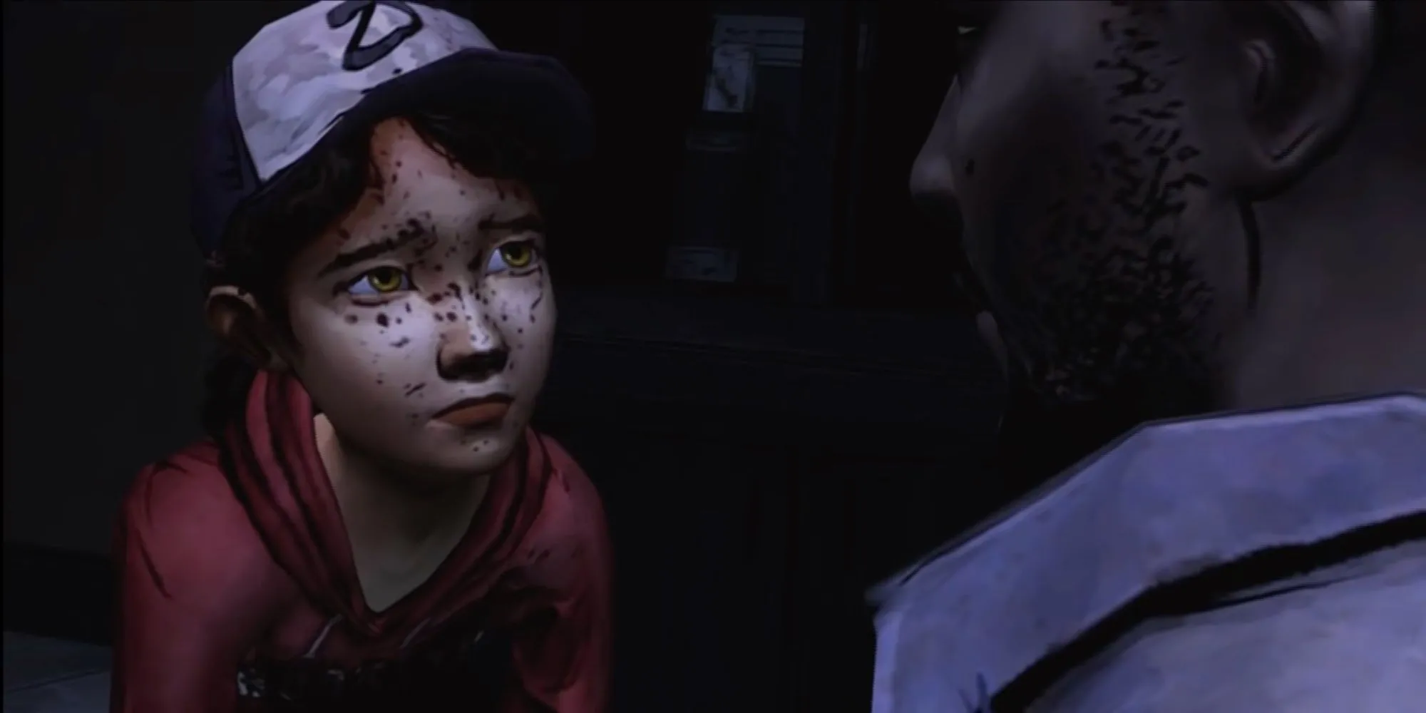 Lee Everett bảo vệ Clementine trong một cảnh game The Walking Dead Telltale đầy cảm xúc