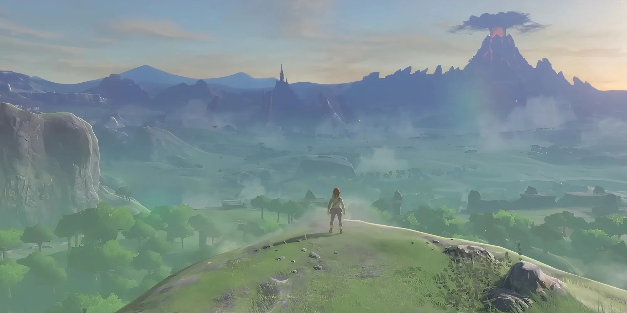 Link trong Zelda Breath of the Wild đứng trên vách đá nhìn ra thế giới Hyrule rộng lớn