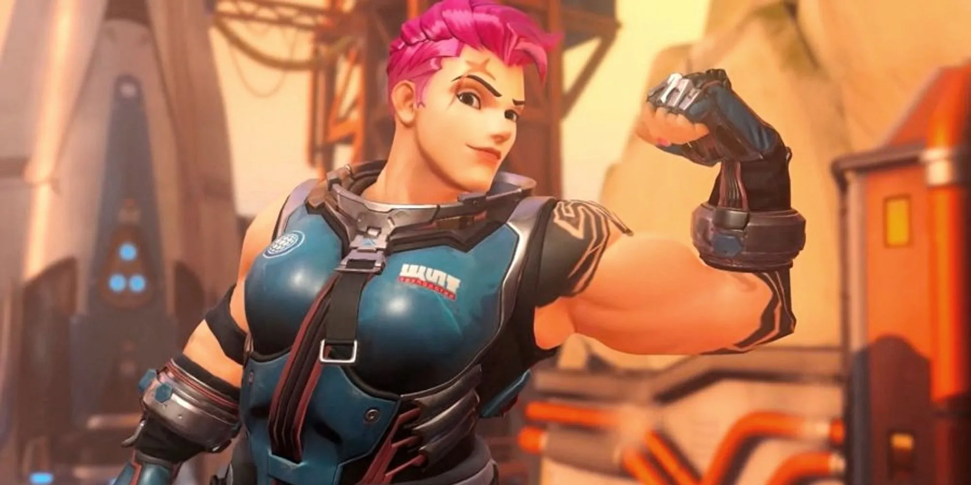 Nhân vật Zarya trong Overwatch 2 đang gồng bắp tay trái và mỉm cười