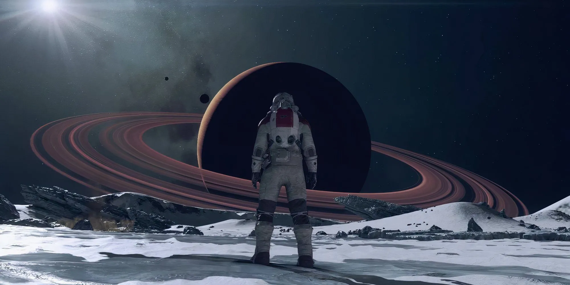 Phi hành gia trong Starfield đứng trên một hành tinh xa lạ nhìn về phía Sao Thổ và vành đai của nó