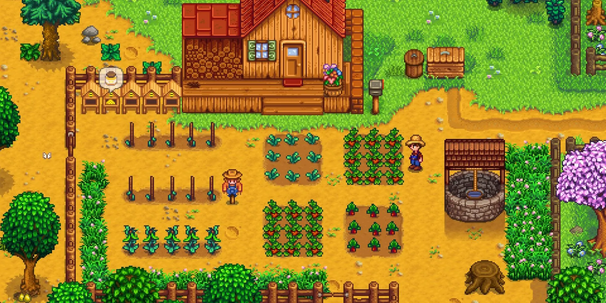 Nông trại với cây trồng, giếng nước, bù nhìn và tổ ong trong game Stardew Valley