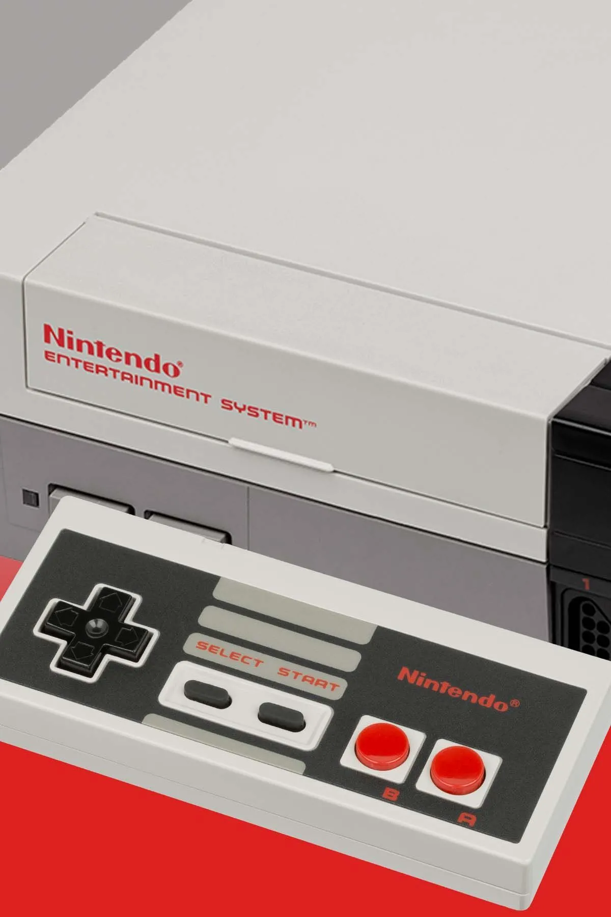 Hình ảnh cận cảnh máy chơi game Nintendo Entertainment System (NES) màu xám, biểu tượng của kỷ nguyên game retro