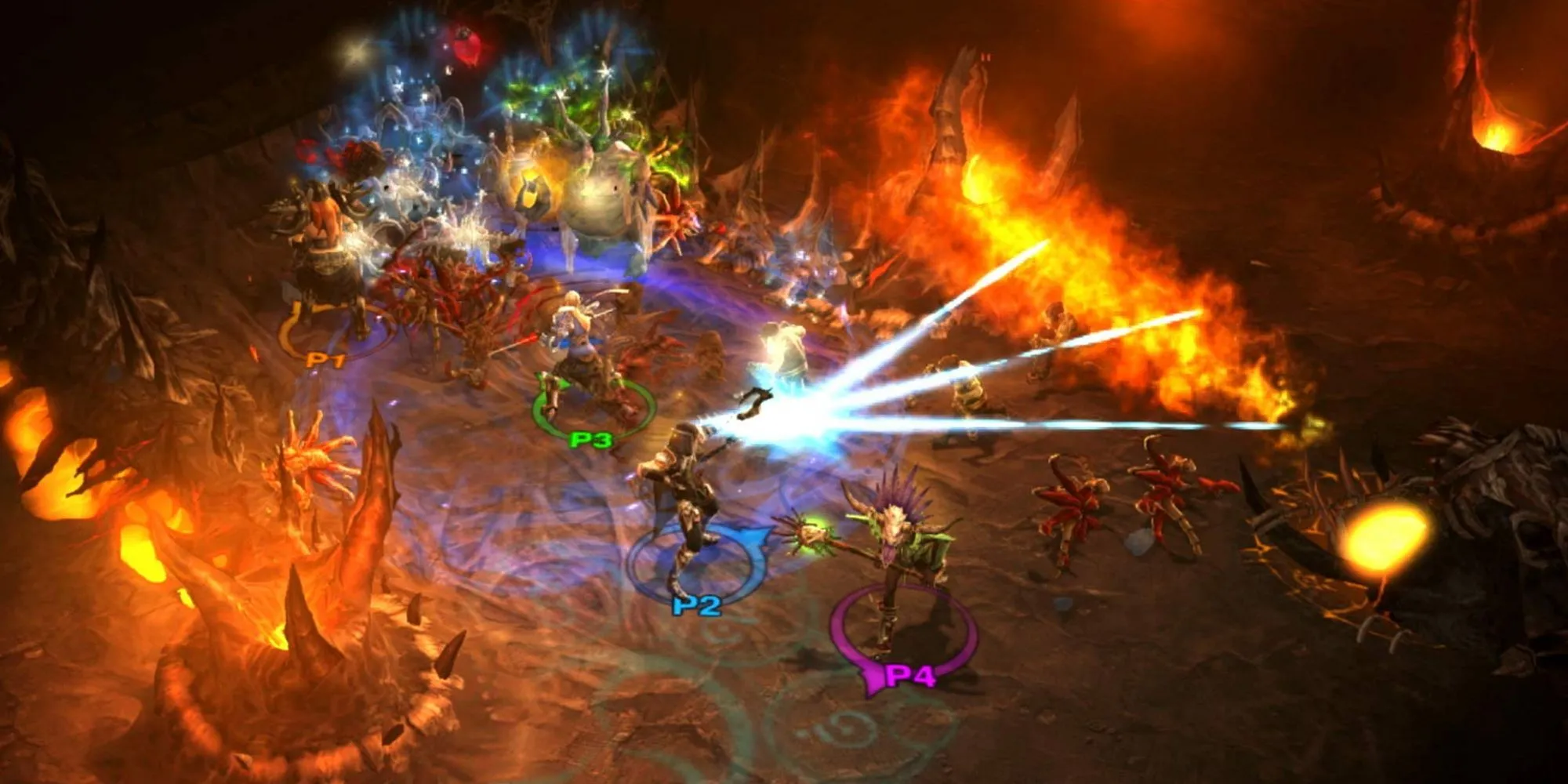 Ba nhân vật trong Diablo 3 đang chiến đấu với một đám quái vật khổng lồ trong một hang động tối tăm