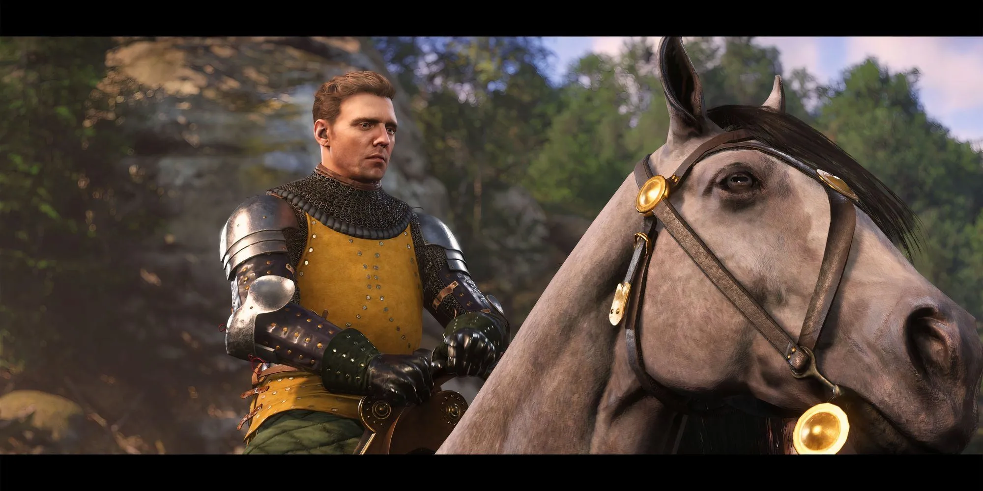 Henry cưỡi ngựa Pebbles cùng các đồng đội khác trong Kingdom Come Deliverance 2