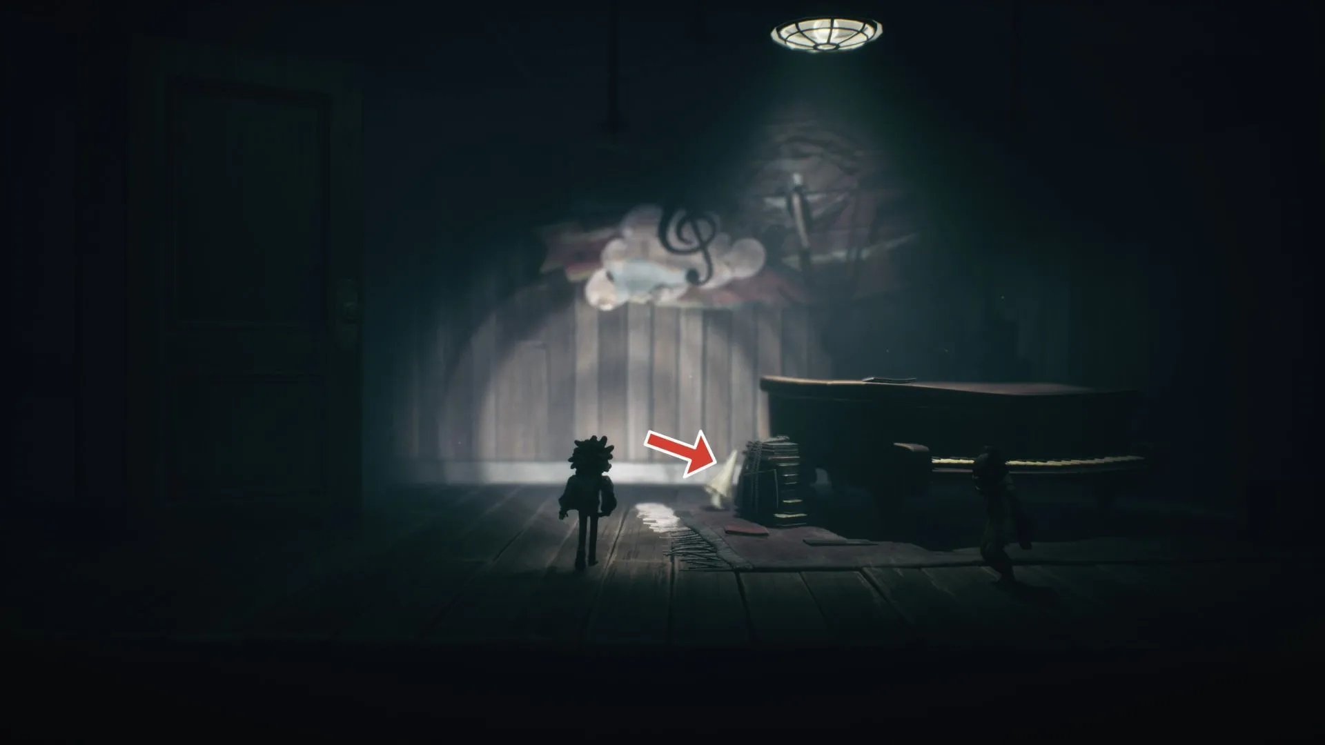 Tên Nome thứ năm chạy ra sau piano khi cửa bí mật mở Little Nightmares 3
